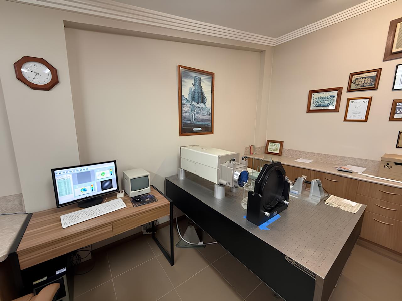 Fry Optics office interior with modern workspace and equipment.